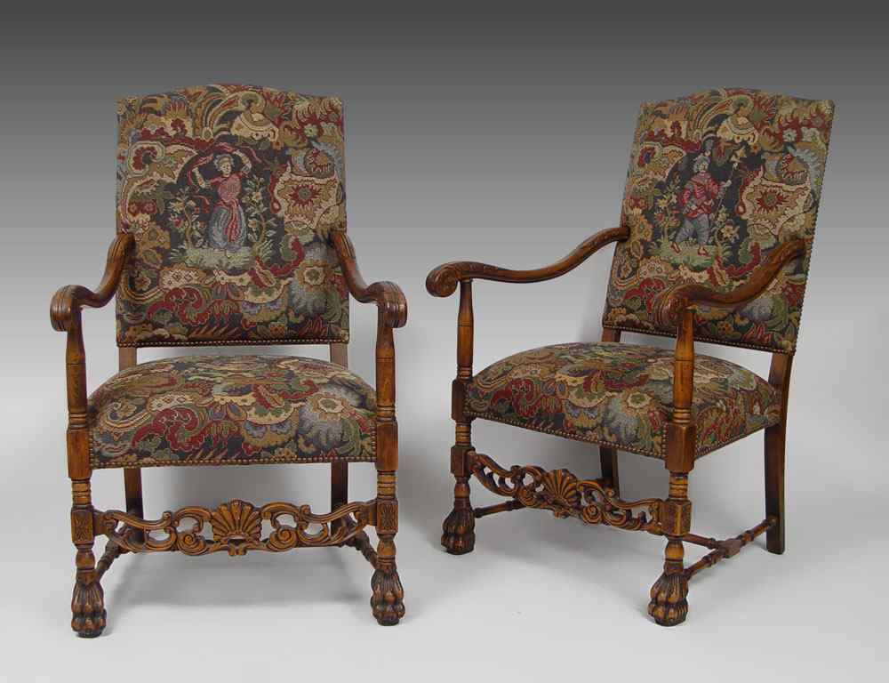 Appraisal: PAIR OF UPHOLSTERED AND CARVED THRONE TYPE ARM CHAIRS Tapestry