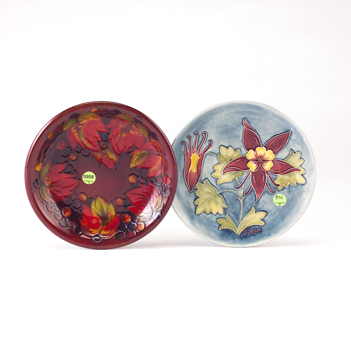 Appraisal: MOORCROFT Two plates the Grape pattern shallow dish with red