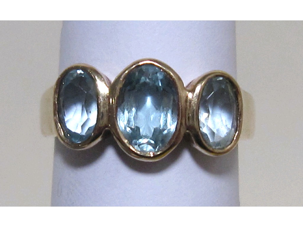 Appraisal: Nine carat gold blue topaz three stone ring