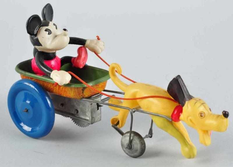 Appraisal: Disney Mickey Pluto Jolly Cart Wind-Up Toy Description Japanese Circa