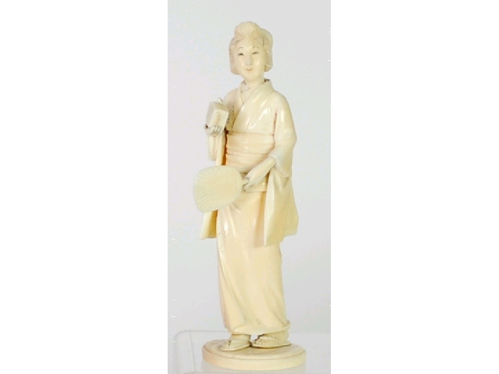 Appraisal: JAPANESE CARVED SECTIONAL IVORY OKIMONO of a female holding a