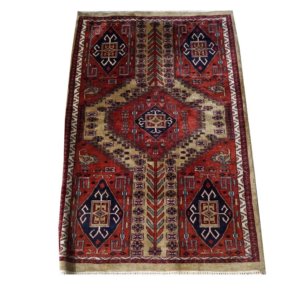 Appraisal: PERSIAN CAMEL HAIR RUGred and beige field Provenance The Estate