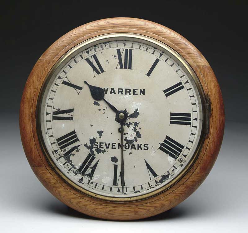 Appraisal: ENGLISH OAK ROUND SCHOOLHOUSE CLOCK White painted dial with Warren