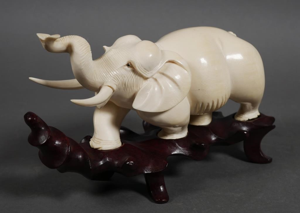 Appraisal: Thick full-body Indian elephant carving with coiled upturned trunk Measures