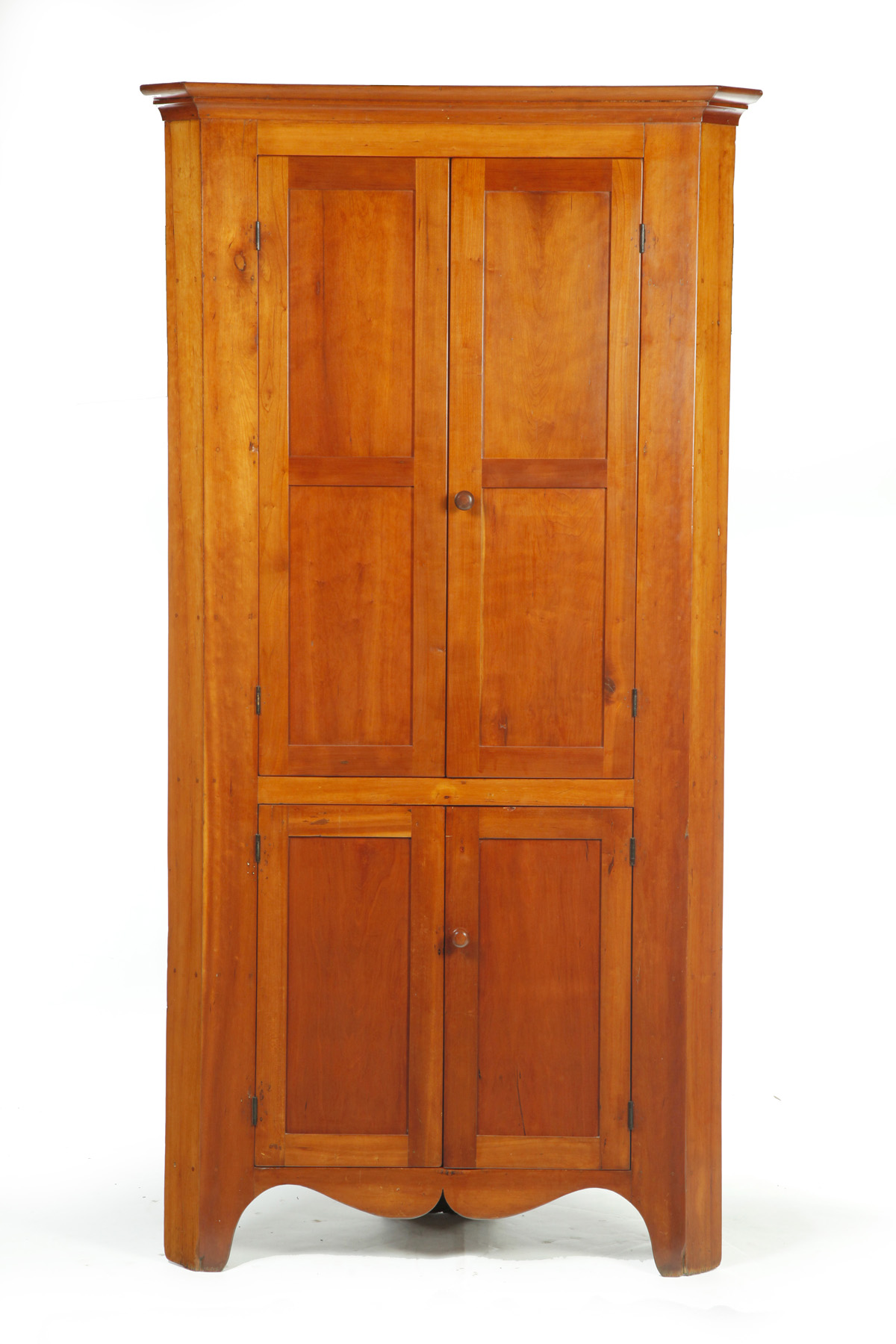 Appraisal: ONE-PIECE BLIND DOOR CORNER CUPBOARD American mid th century cherry