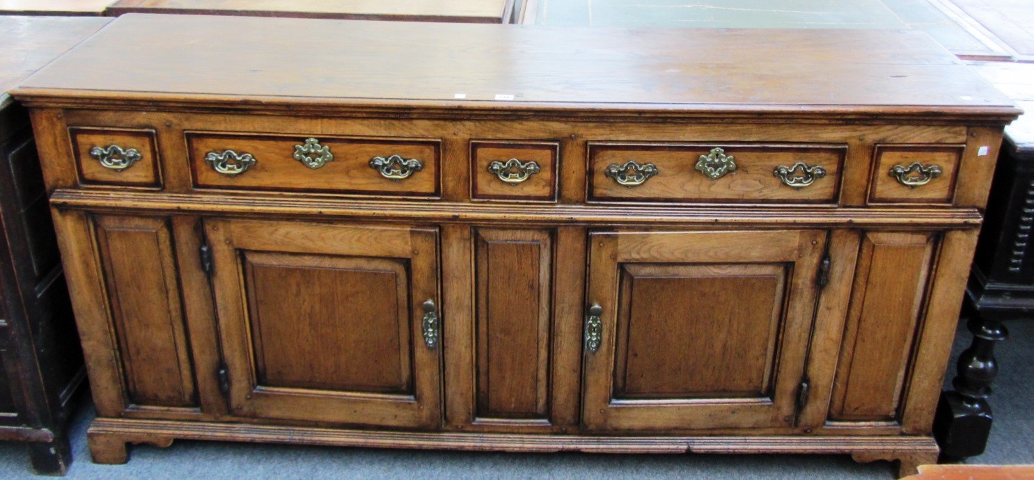 Appraisal: An th century style oak dresser with five drawers over