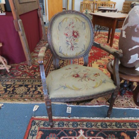 Appraisal: French Carved Arm Chair needlepoint seat circa