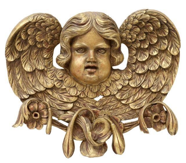 Appraisal: Continental giltwood architectural wall plaque th c winged cherub mask