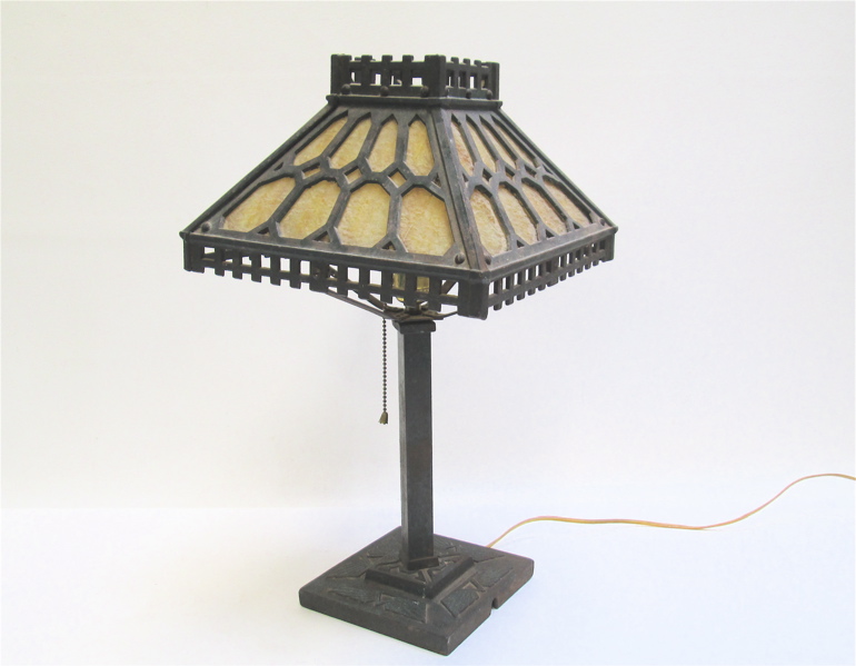 Appraisal: CARAMEL SLAG GLASS TABLE LAMP having gothic geometric framing on