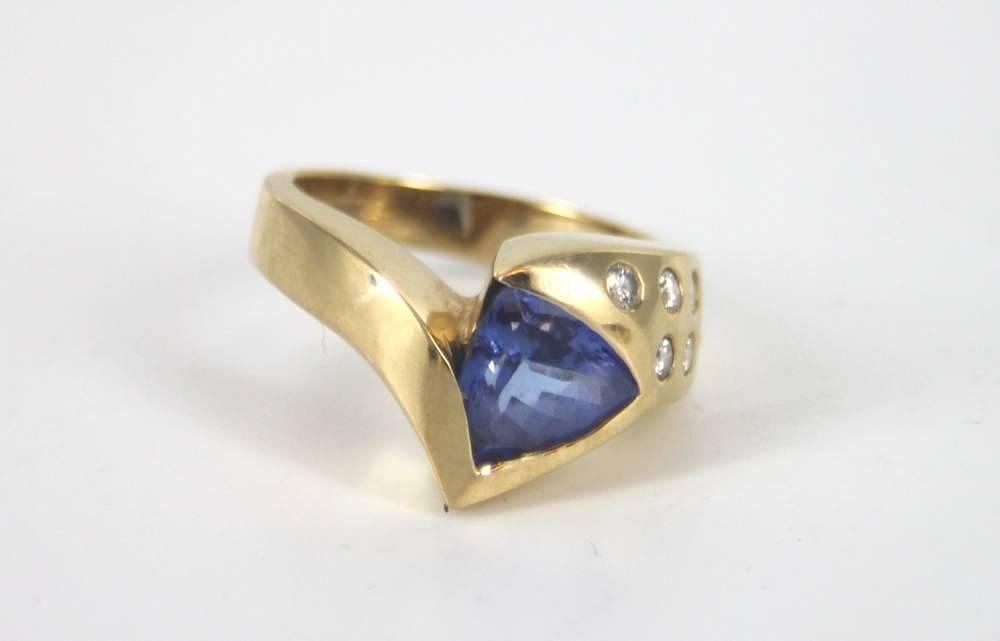 Appraisal: Tanzanite trillion diamond ring A tanzanite trillion diamond ring Marked