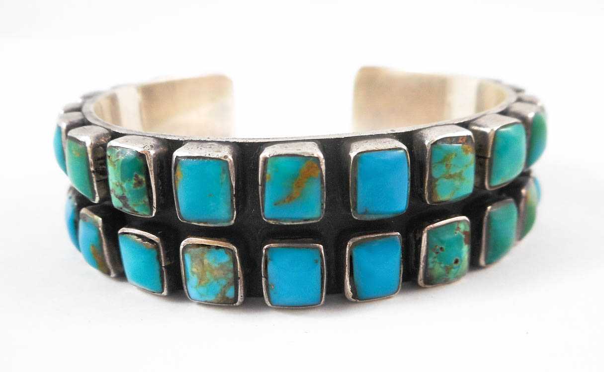 Appraisal: JEANNE FELIX TSINIJINNIE SILVER AND TURQUOISE BRACELET the cuff bracelet