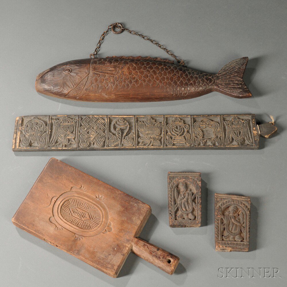 Appraisal: Five Wood Carvings China and Japan th century a fish