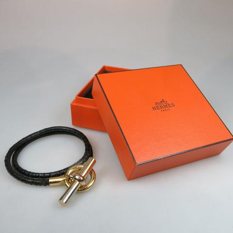 Appraisal: Hermes Braided Leather And Gold Tone Metal Necklace with the