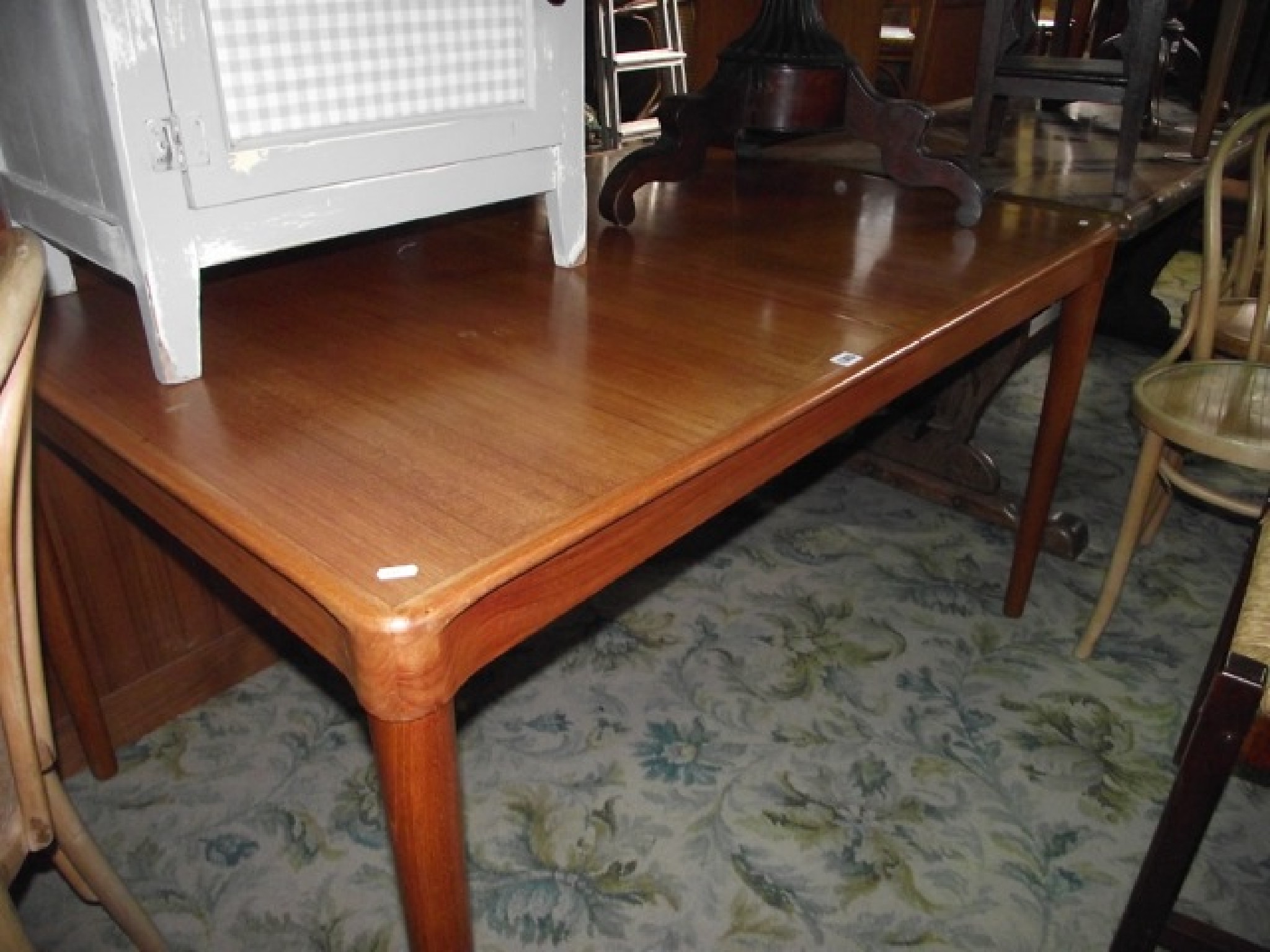 Appraisal: A mid- th century Danish teak extending dining table of