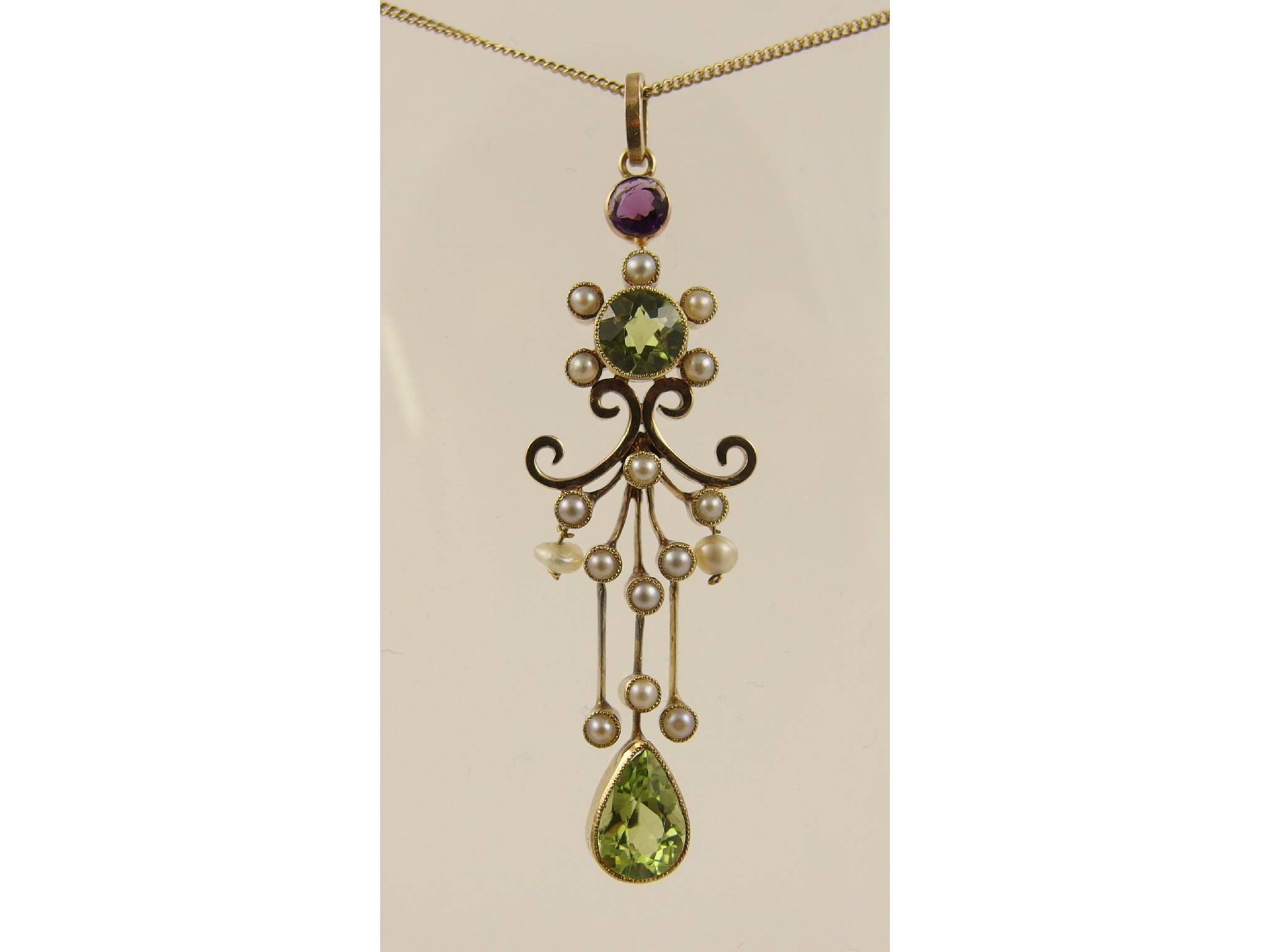 Appraisal: A ct Edwardian pendantset with peridots amethyst and split pearls