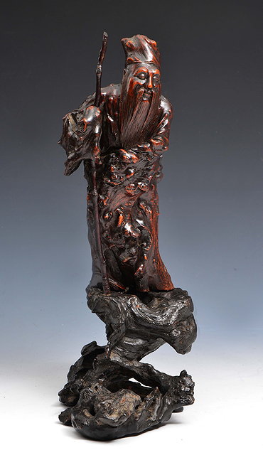 Appraisal: A CHINESE CARVED WOOD FIGURE OF LAO TZE with staff