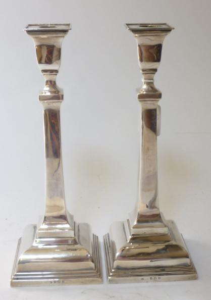 Appraisal: A PAIR OF CANDLESTICKS maker's mark rubbed Birmingham with fixed