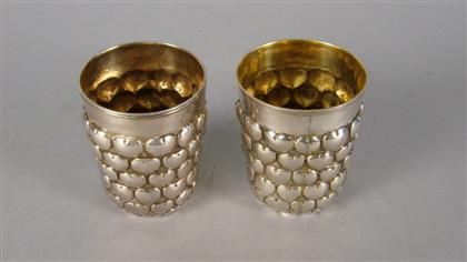 Appraisal: Austrian silver tumbler Decorated with pressed hearts together with a