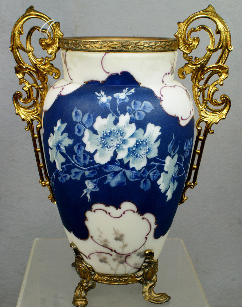 Appraisal: Wavecrest vase with blue and white floral decoration ornate bronze