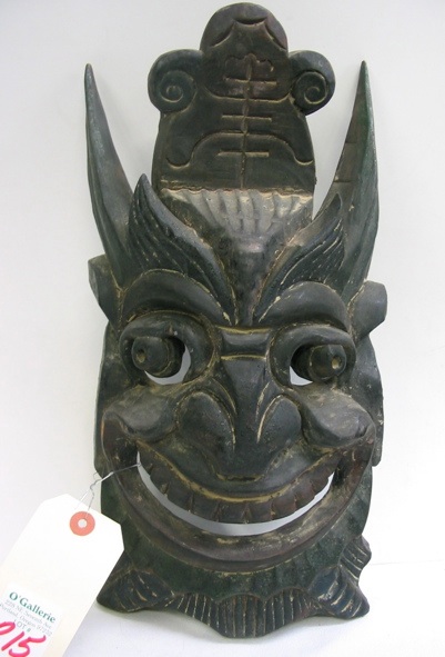 Appraisal: A SINO-TIBETAN WOODEN FACE MASK and a contemporary pottery figure