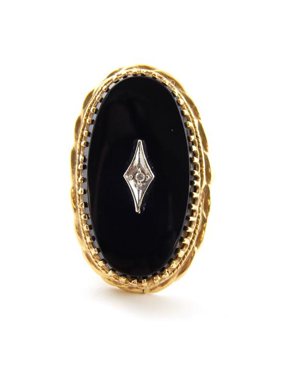 Appraisal: JEWELRY onyx and diamond ring K yellow gold contains one