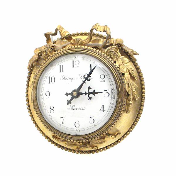 Appraisal: A French gilt metal cartel timepiece the white enamel dial