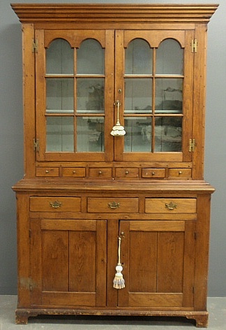 Appraisal: - Pine two piece Dutch cupboard c with a molded