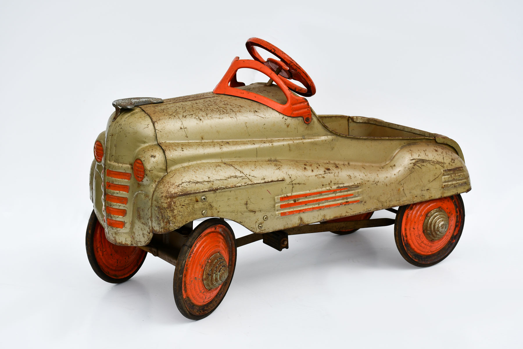 Appraisal: CHAMPION STUDEBAKER PEDAL CAR Bronze with orange detailing including steering