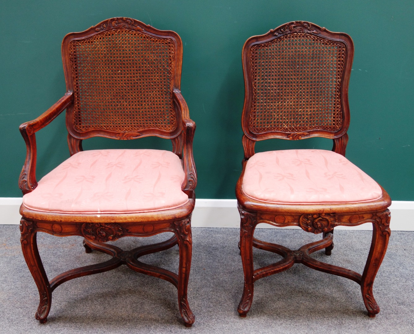 Appraisal: A set of twelve French walnut dining chairs of Louis