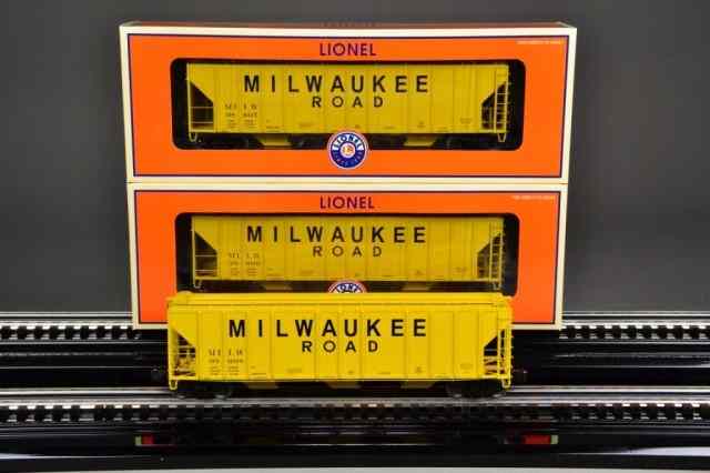 Appraisal: LIONEL MILWAUKEE ROAD HOPPERSIncluding three yellow - Lionel Milwaukee road