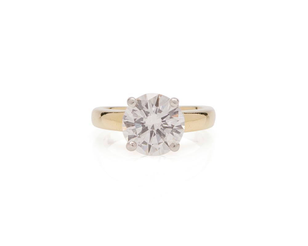 Appraisal: K Gold Platinum and Diamond Ring centering a round brilliant-cut