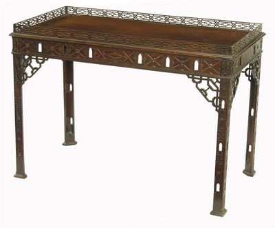 Appraisal: A mahogany rectangular silver table the pierced fret galleried top