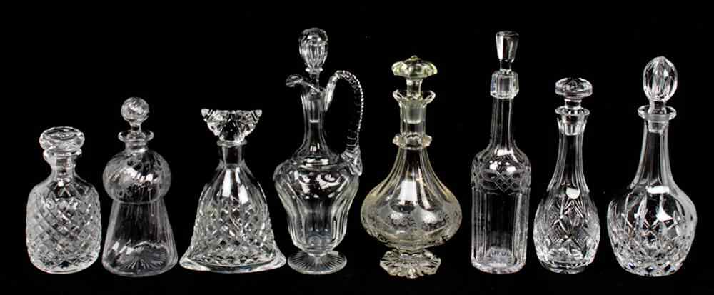 Appraisal: COLLECTION OF EIGHT GLASS DECANTERS Including one Waterford bottle shaped