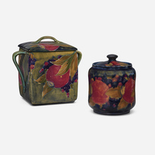 Appraisal: Moorcroft Pottery Pomegranate covered jar and biscuit jar set of