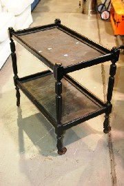 Appraisal: A Regency style ebonized drinks trolley