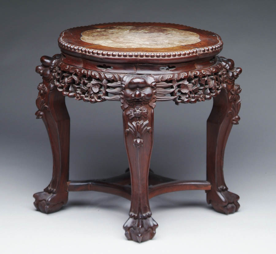 Appraisal: ORIENTAL ROSEWOOD MARBLE TOP CARVED STAND Shaped round top having