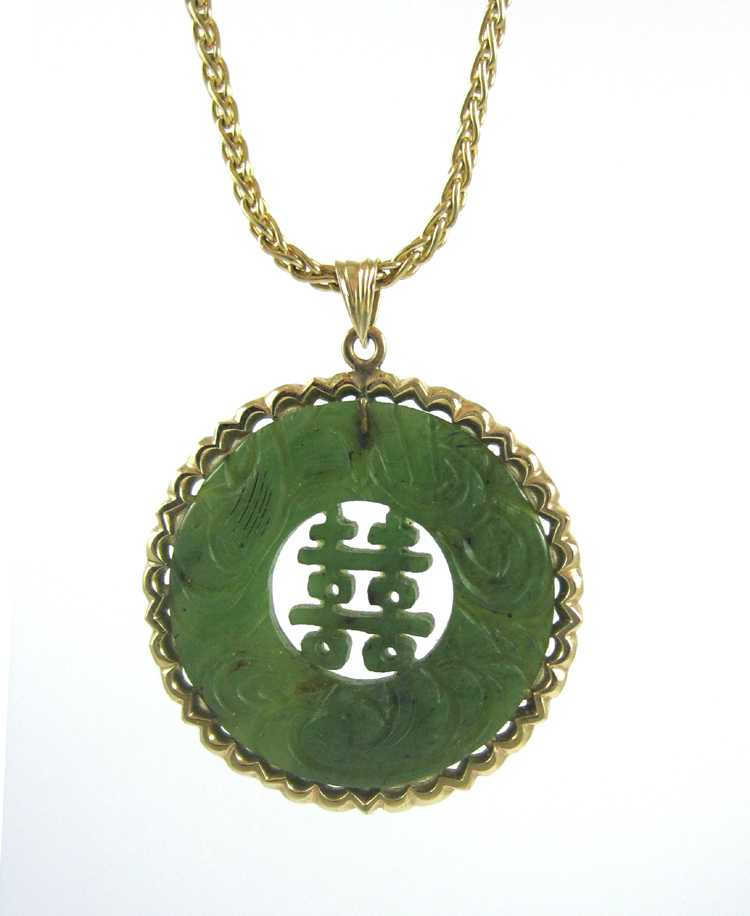 Appraisal: CHINESE SPINACH JADE AND FOURTEEN KARAT GOLD PENDANT NECKLACE a