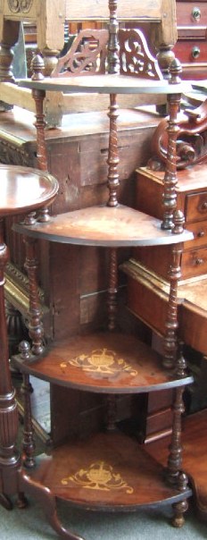 Appraisal: A Victorian inlaid walnut graduated four tier corner what-not with