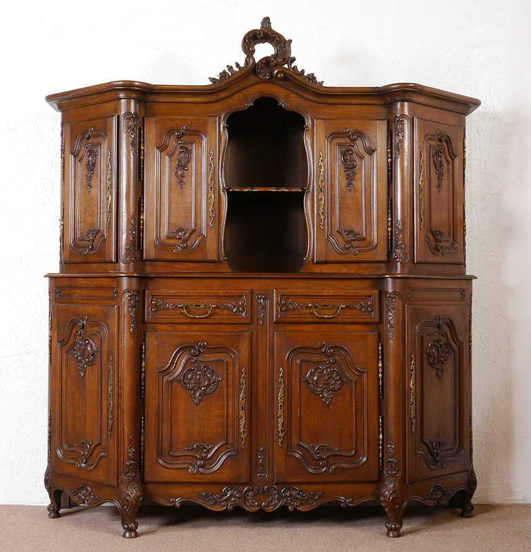 Appraisal: CARVED COUNTRY FRENCH CUPBOARD Carved foliate scroll crest to top