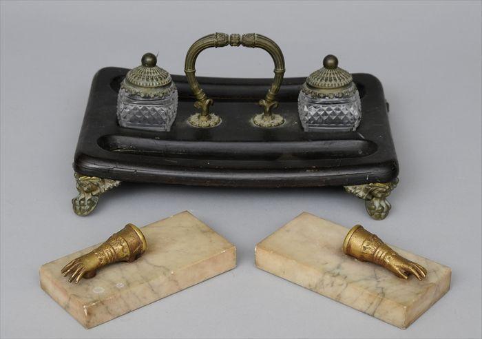 Appraisal: REGENCY EBONIZED BRASS AND CUT GLASS INKSTAND Raised on lion's