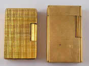 Appraisal: An S T Dupont Paris gold plated cigarette lighter together