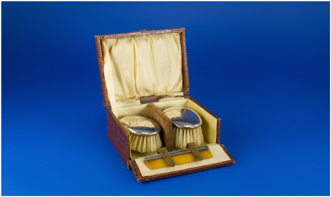 Appraisal: 's Travelling Silver Backed Brush and Comb Set In original