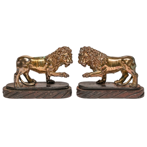 Appraisal: A pair of electroformed bronzed metal sculptures of lions on