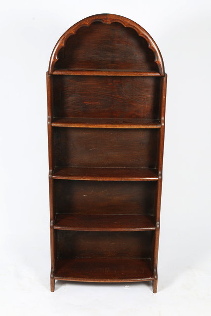 Appraisal: AN OAK BOOKCASE with arching top cm wide x cm