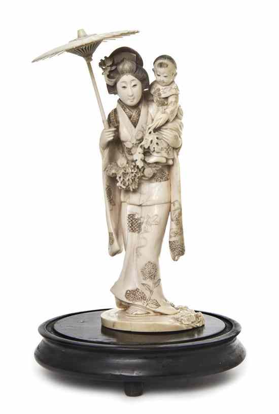 Appraisal: A Japanese Ivory Figure of a Woman depicted with her