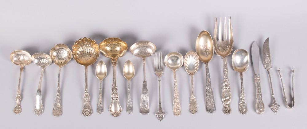 Appraisal: FOUR PIERCED SPOONS ONE HERALDIC SERVING FORK TWO PIECES VICTORIAN