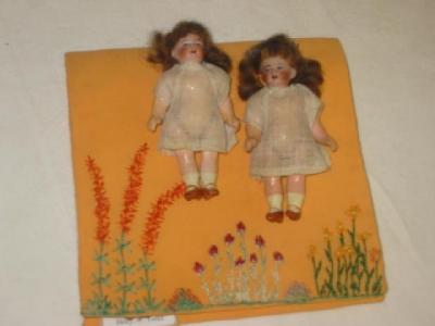 Appraisal: A pair of all bisque dolls house dolls with painted