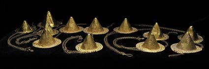 Appraisal: Group of Twelve Gold Dress Ornaments with Punched Decoration