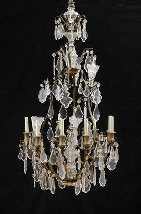 Appraisal: LOUIS XV-STYLE CUT-GLASS-MOUNTED GILT-METAL NINE-LIGHT CHANDELIER The pear-form skeletal frame