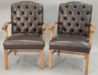 Appraisal: Pair of leather and oak armchairs Pair of leather and